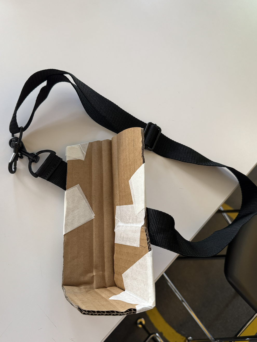 cardboard phone cradle prototype with strap